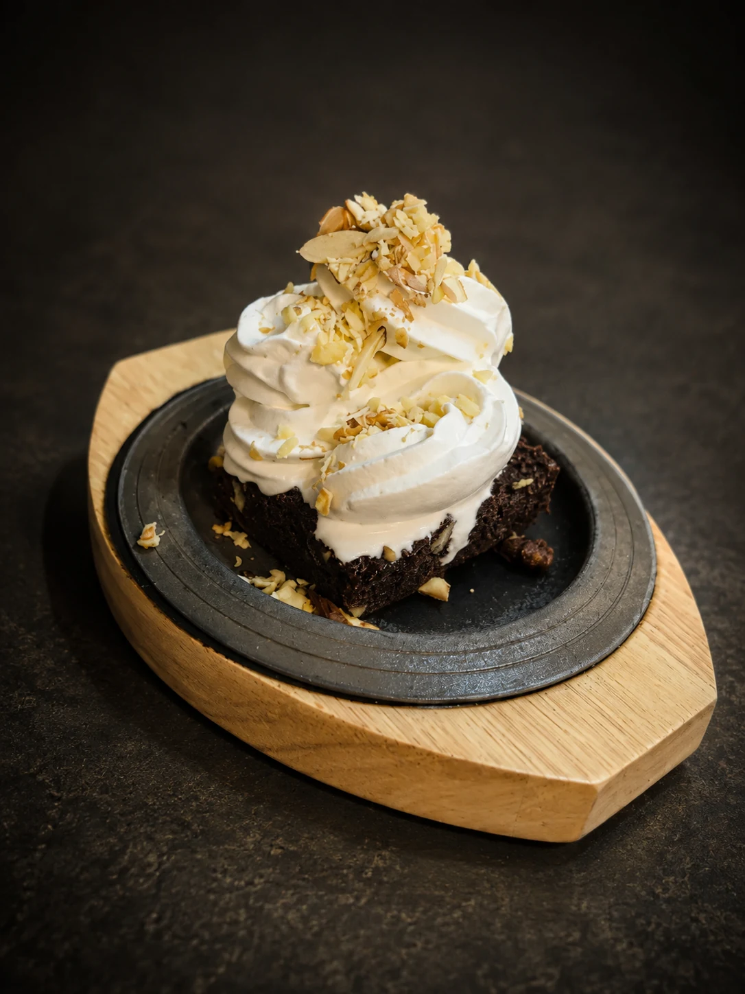 Chocolate brownie topped with ice cream